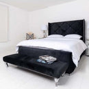 Black plush Modena Wingback bed frame with matching buttons and beading on headboard